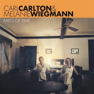 Carlton, Carl & Melanie Wiegmann – Miles of Time